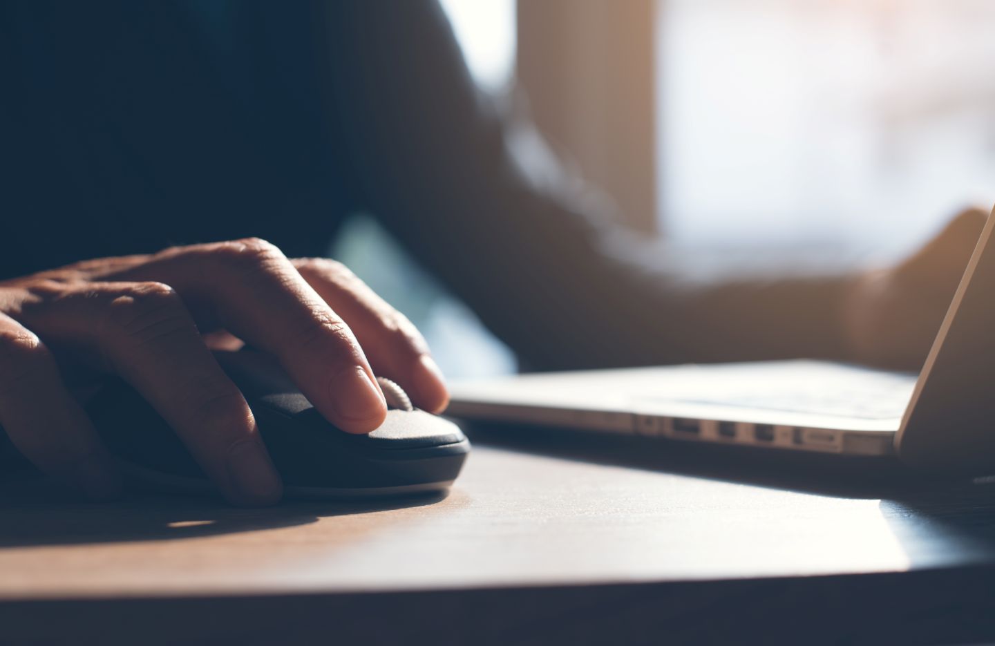 Person at computer using a mouse